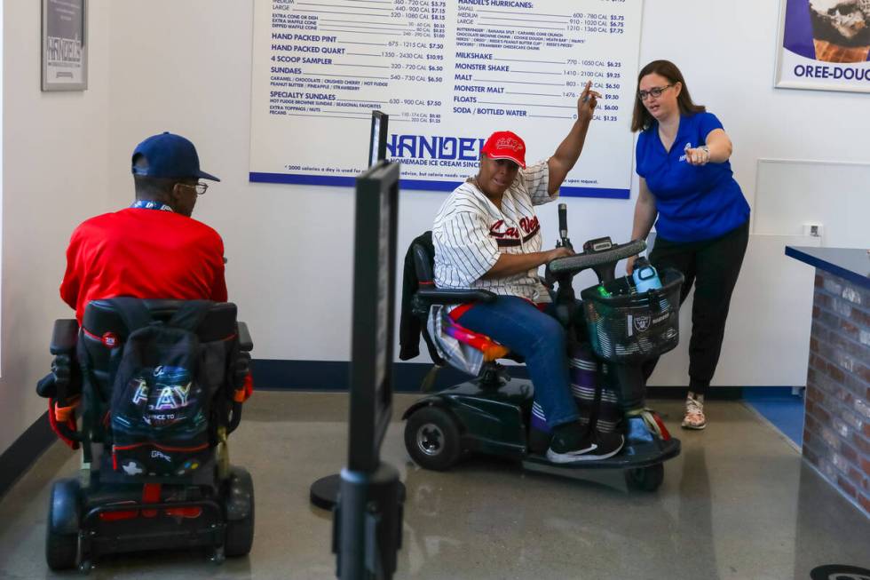 Candy and Kevin Jones, of Henderson, excitedly enter the store at the front of the line during ...