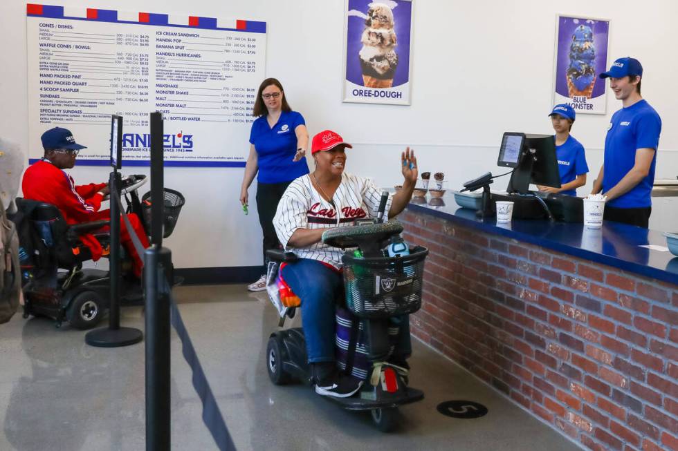 Candy and Kevin Jones, of Henderson, excitedly enter the store at the front of the line during ...