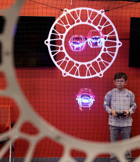 Gaddiel “Prodigy” De La Cruz, 12, plays drone soccer during Drone Soccer Camp at ...