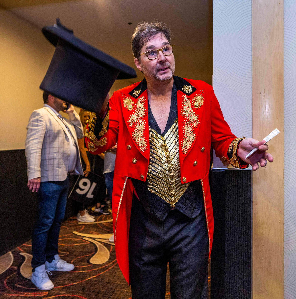 Phil Hellmuth tips his hat as the “The Greatest Showman!" Before his entrance durin ...