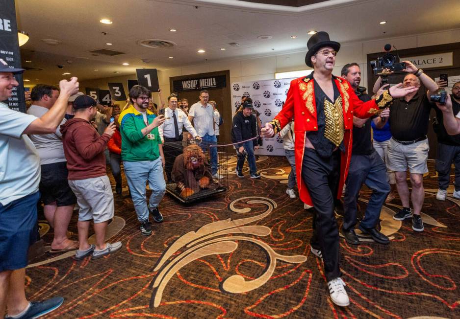 Phil Hellmuth as the “The Greatest Showman!" pulls a cage with Daniel "Junglem ...