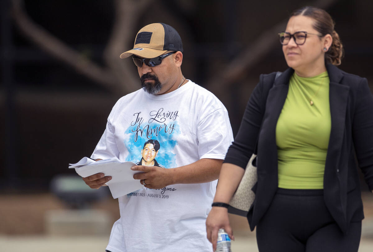 Francisco Rodriguez, left, wearing a T-shirt with an image of his son Javier Rodriguez, who was ...