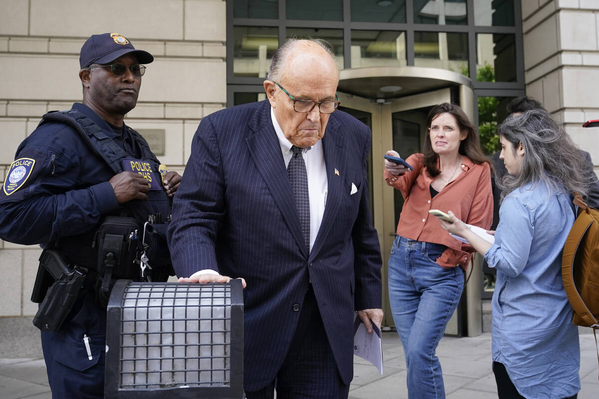 FILE - Former New York City Mayor Rudy Giuliani departs the federal courthouse, Friday, May 19, ...