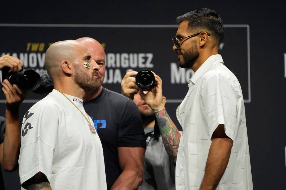 Alexander Volkanovski, left, and Yair Rodriguez pose during a news conference for the UFC 290 M ...