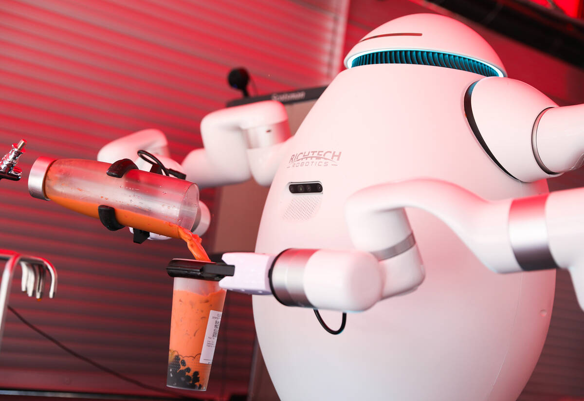 Adam the robot prepares a customer’s boba tea at Cloutea, the first boba tea store run b ...