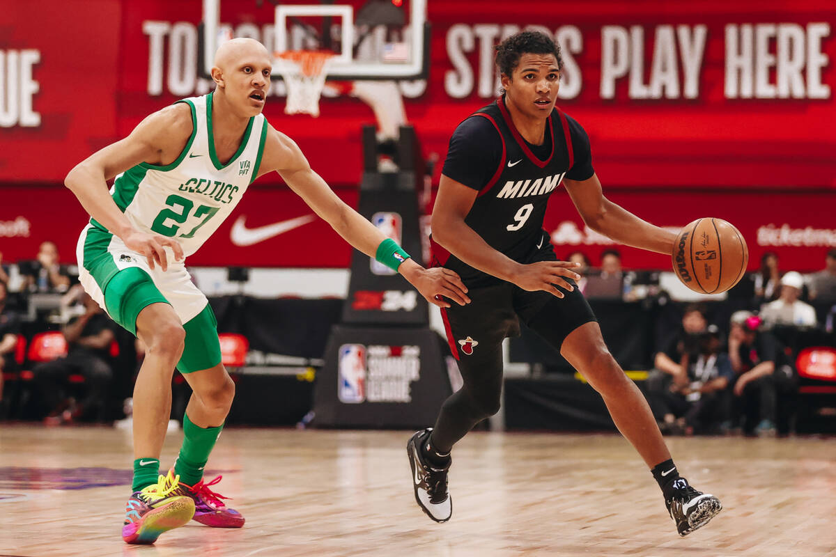 Miami Heat guard Dru Smith (9) dribbles the ball up the court as Boston Celtics forward Jordan ...