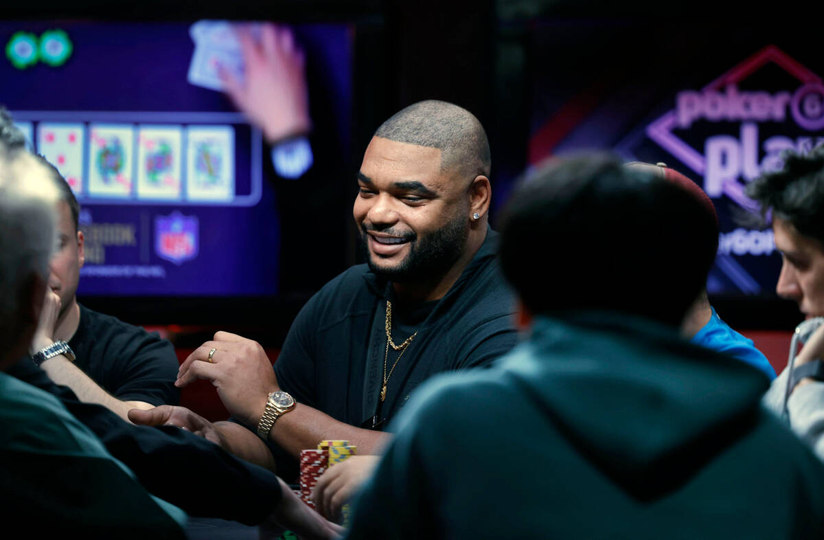 Former NFL player Richard Seymour center, competes with other players during World Series of Po ...