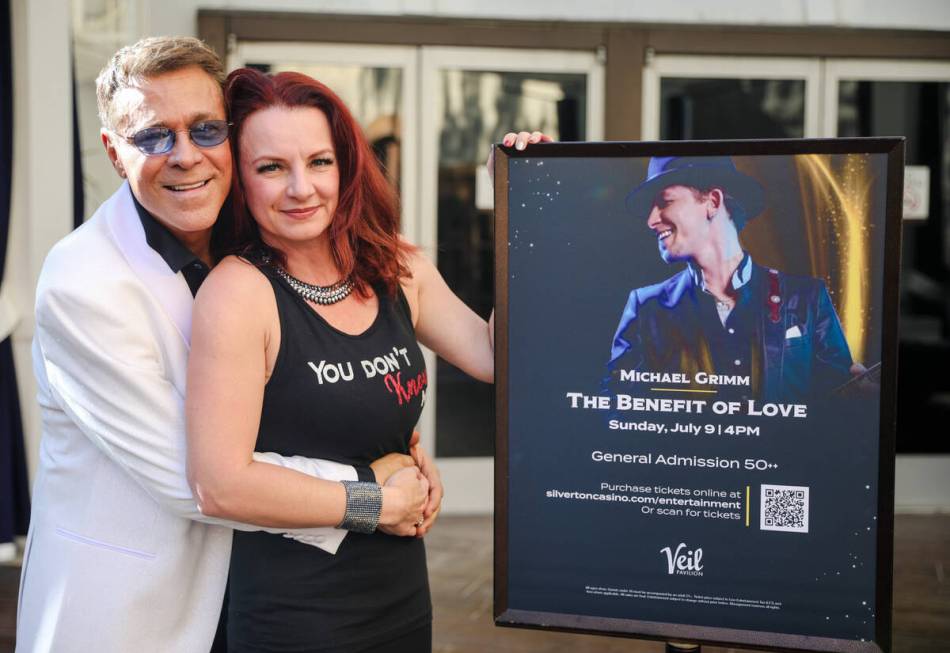 Vegas showman Mark OToole, left, and Lucie Grimm, wife of Michael Grimm, right, pose for a port ...