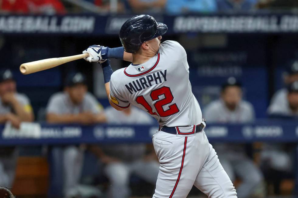 Atlanta Braves' Sean Murphy follows through on a three-run home run against the Tampa Bay Rays ...