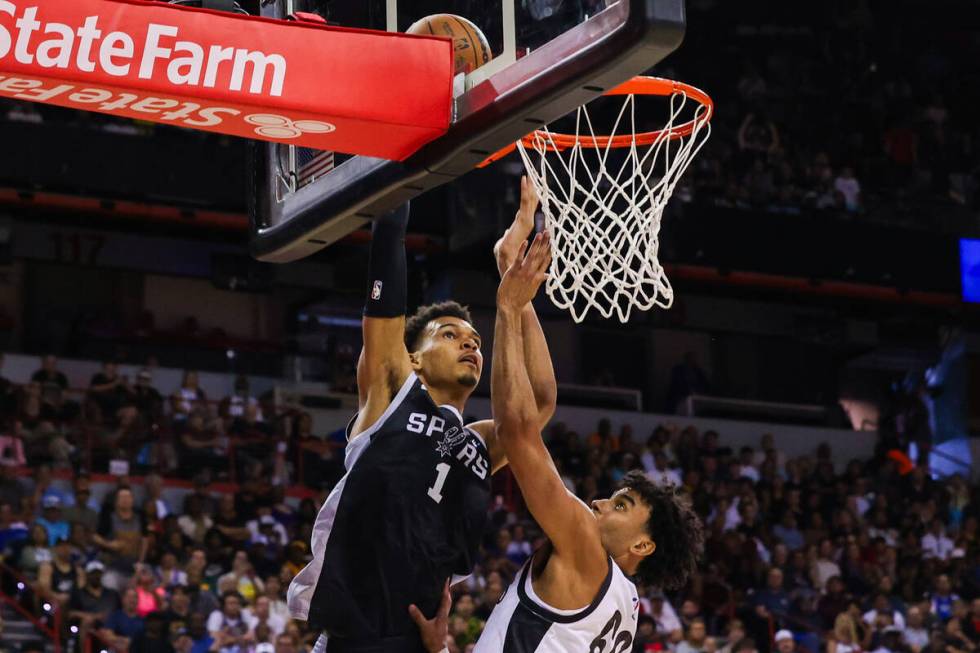 San Antonio Spurs forward Victor Wembanyama (1), the number one pick in the NBA draft, dunks th ...