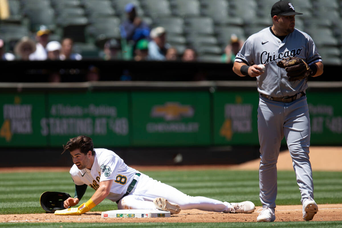 Oakland Athletics' Tyler Wade (8) looks toward the dugout after being tagged out by Chicago Whi ...