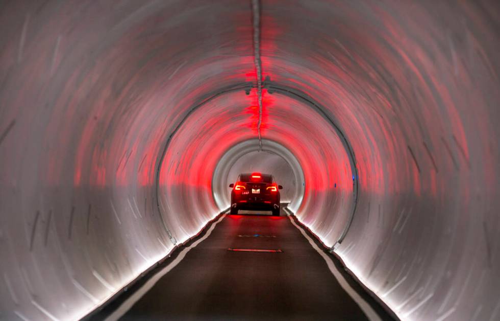 A Tesla is navigated from the West Hall to Central Hall at the Las Vegas Convention Center in J ...