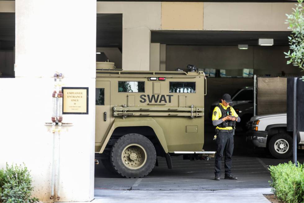 Police presence where a man is holding a woman hostage in a hotel room at Caesars Palace in Las ...