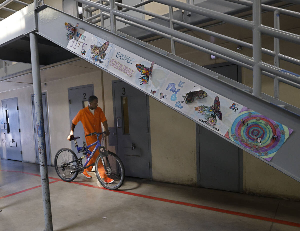 Inmate Ryan Brandon takes a bike to their facility after National Bikes for Veterans brought bi ...