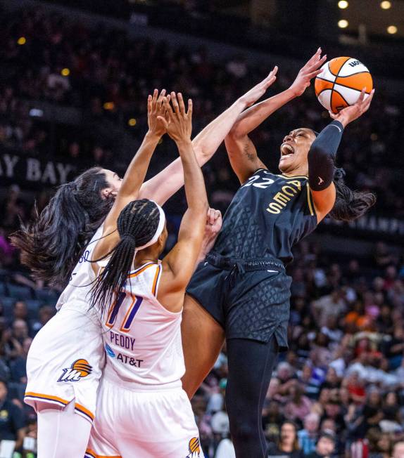 Las Vegas Aces forward A'ja Wilson (22) elevates for a shot over Phoenix Mercury guard Diana Ta ...