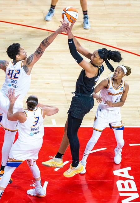 Las Vegas Aces forward A'ja Wilson (22) posts up as Phoenix Mercury center Brittney Griner (42) ...