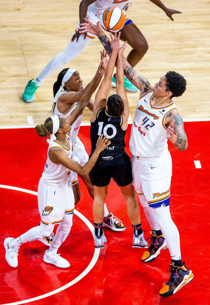 Las Vegas Aces guard Kelsey Plum (10) gets off a shot Phoenix Mercury guard Moriah Jefferson (8 ...