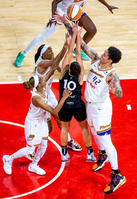 Las Vegas Aces guard Kelsey Plum (10) gets off a shot Phoenix Mercury guard Moriah Jefferson (8 ...