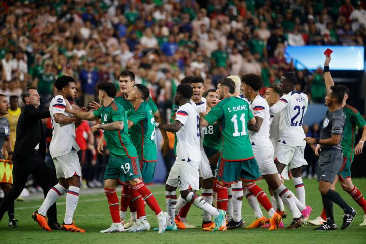 A referee shows a red card during the second half of a CONCACAF Nations League semifinal soccer ...