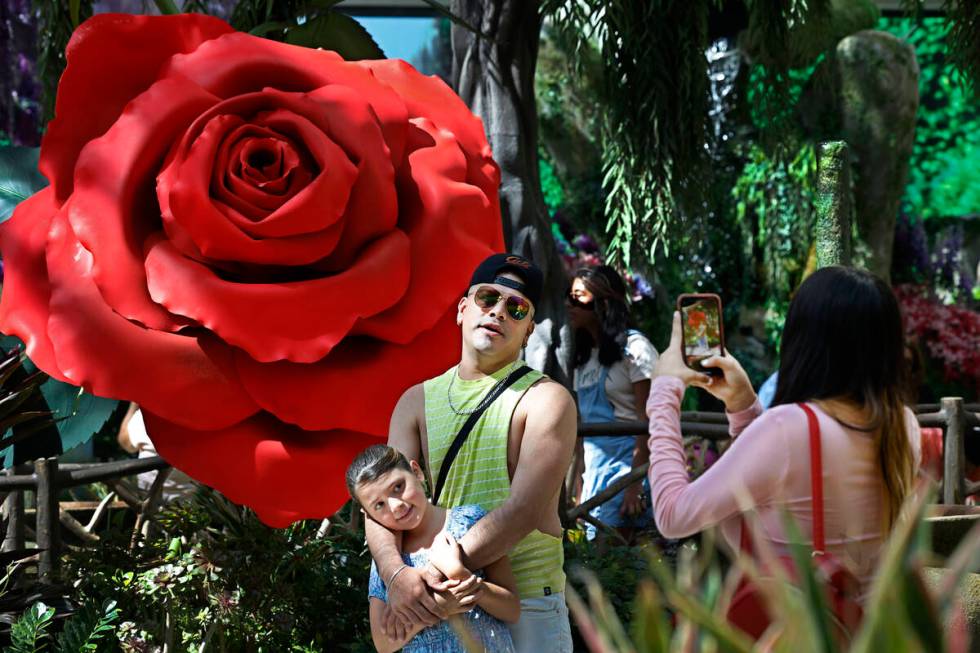 Ricard Lacarriere of Mexico poses for a photo with his daughter Eva, 9, as his sister Ariadna, ...