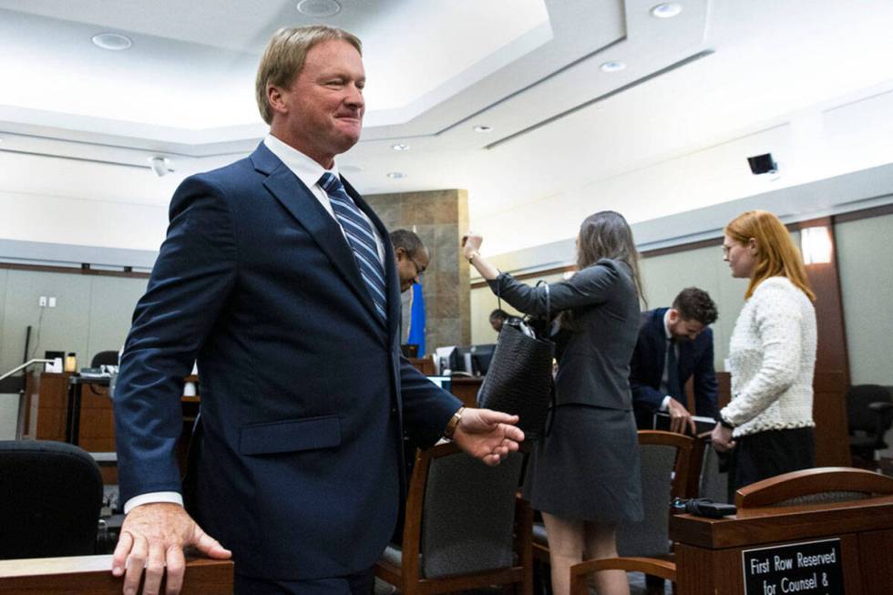 Former Raiders coach Jon Gruden, leaves the courtroom after appearing at a hearing at the Regio ...