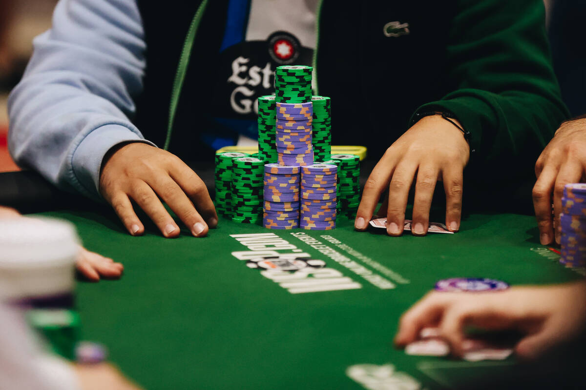 A poker player stacks their chips during the World Series of Poker $10,000 buy-in no No-limit H ...