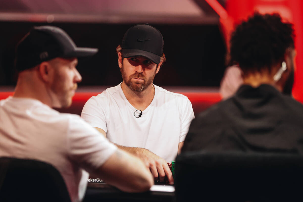 Professional poker player John Racener competes with other players during the World Series of P ...
