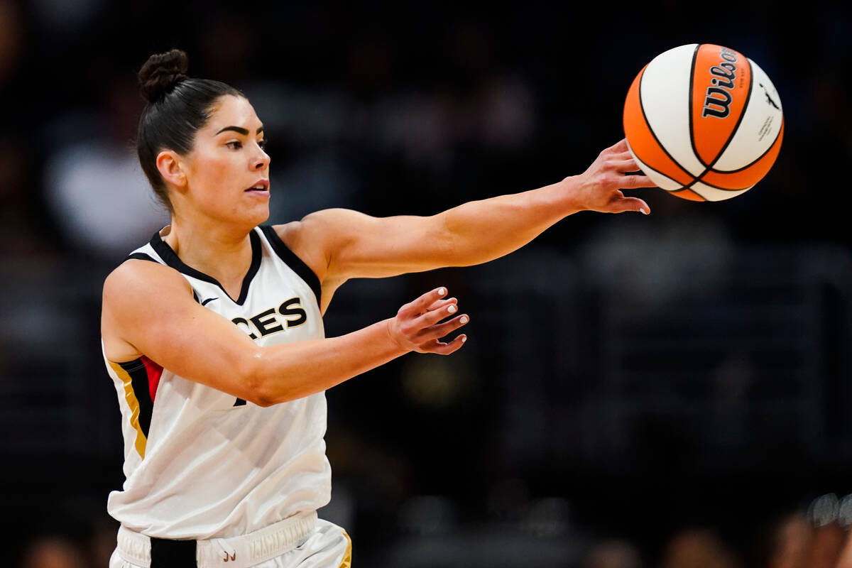 Las Vegas Aces guard Kelsey Plum (10) passes the ball during the first half of the team's WNBA ...