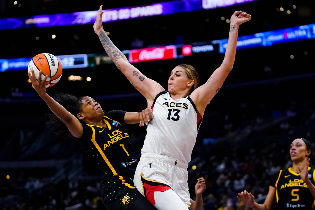 Los Angeles Sparks guard Zia Cooke (1) shoots against Las Vegas Aces forward Cayla George (13) ...