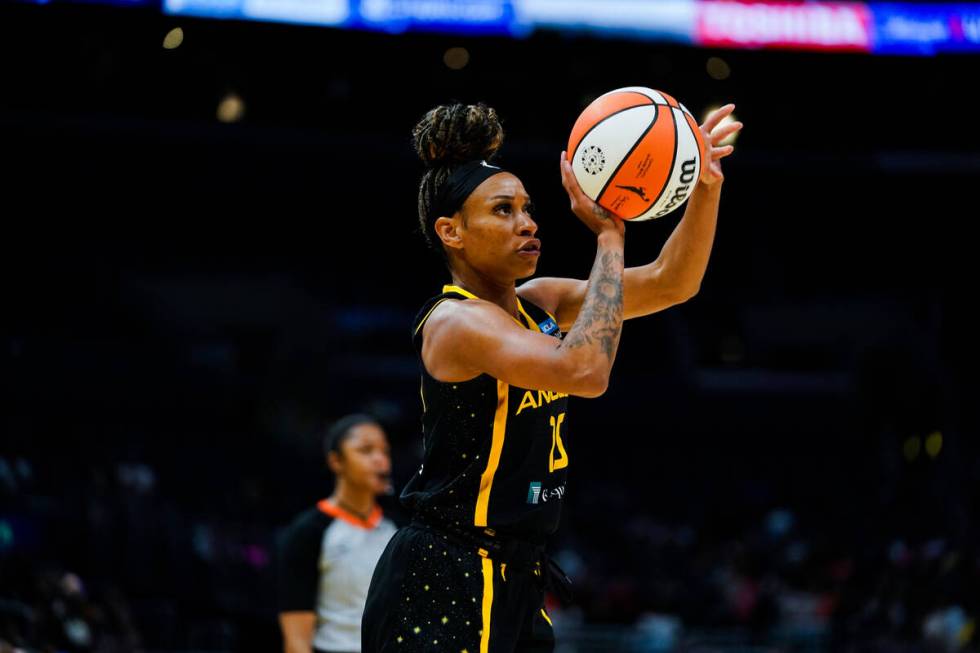 Los Angeles Sparks guard Jasmine Thomas (15) shoots against the Las Vegas Aces during the first ...