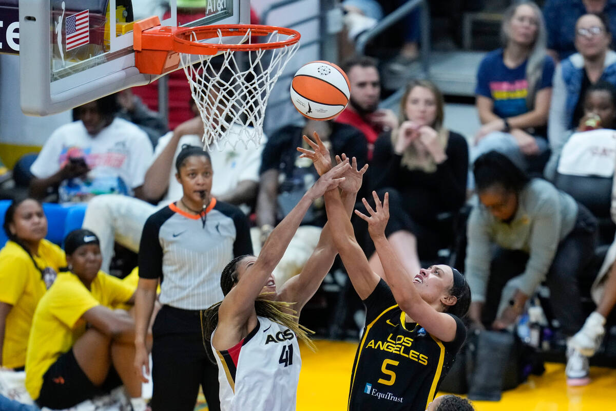 Los Angeles Sparks forward Dearica Hamby (5) shoots against Las Vegas Aces center Kiah Stokes ( ...