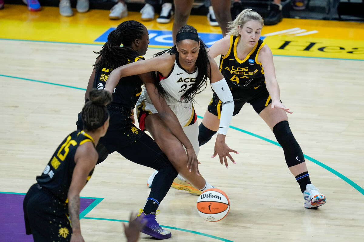 Los Angeles Sparks forward Nneka Ogwumike (30) fouls Las Vegas Aces forward A'ja Wilson (22) du ...