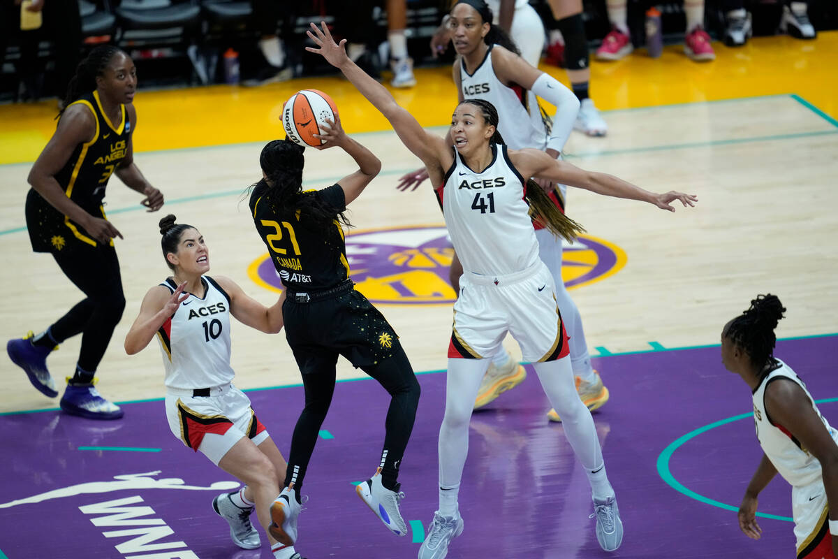 Las Vegas Aces center Kiah Stokes (41) defends against Los Angeles Sparks guard Jordin Canada ( ...