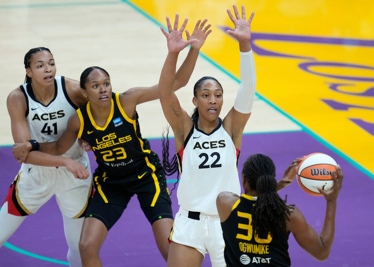 Las Vegas Aces forward A'ja Wilson (22) defends against Los Angeles Sparks forward Nneka Ogwumi ...