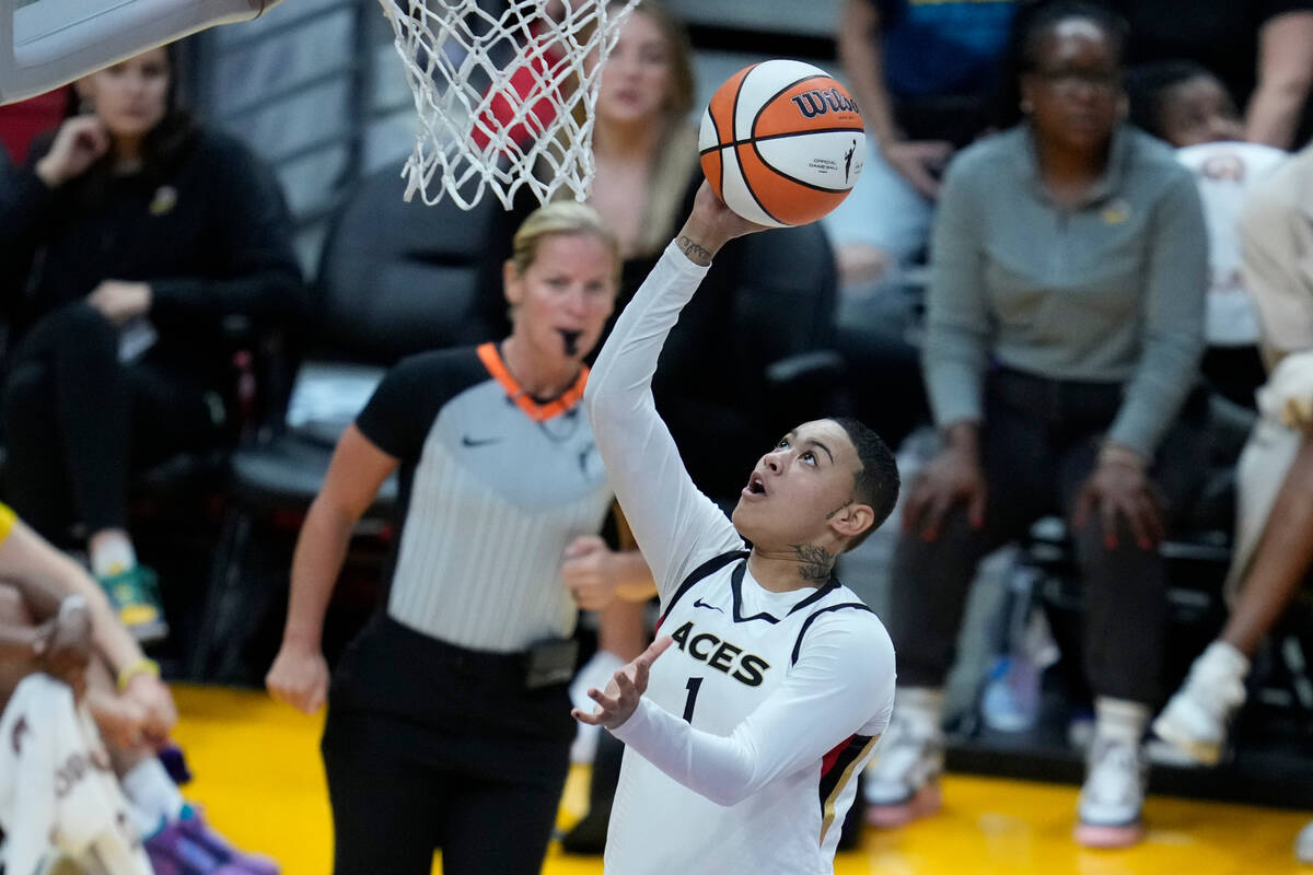 Las Vegas Aces guard Kierstan Bell (1) shoots during the first half of a WNBA basketball game a ...