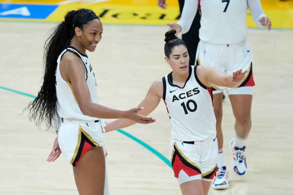 Las Vegas Aces forward A'ja Wilson, left, celebrates with guard Kelsey Plum (10) during the fir ...