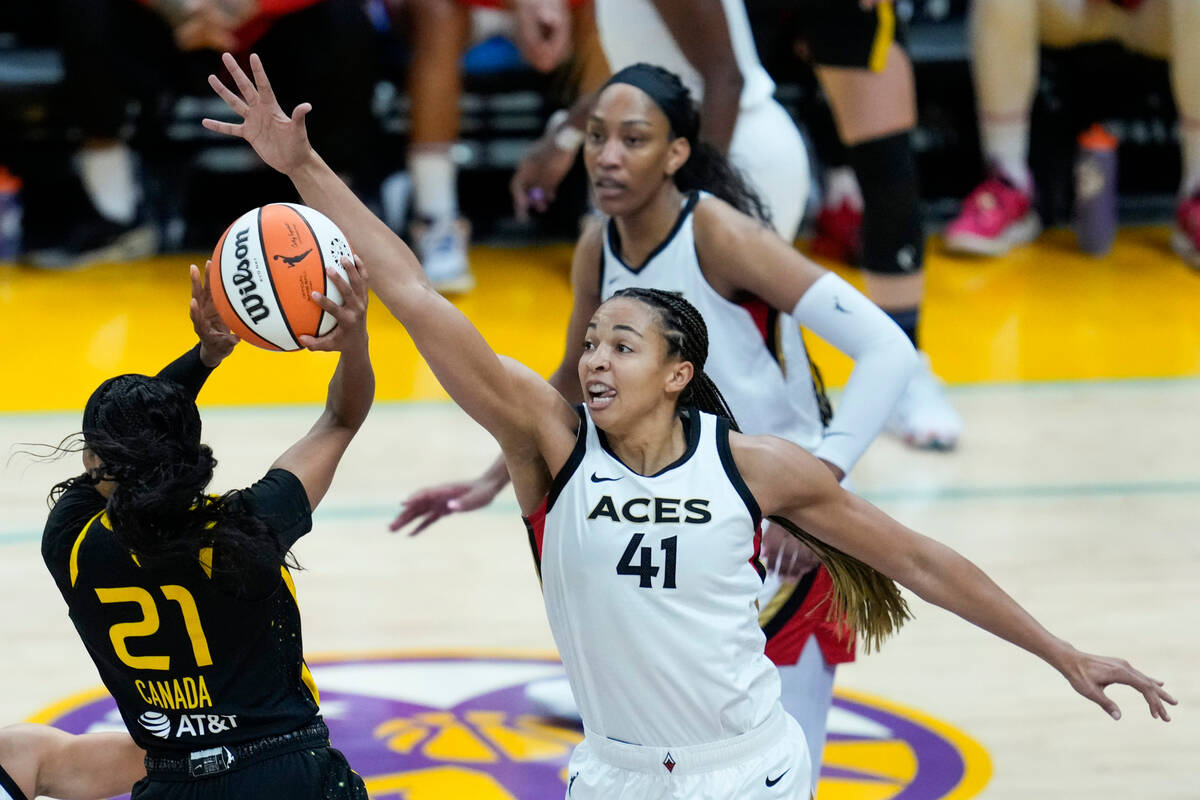 Las Vegas Aces center Kiah Stokes (41) defends against Los Angeles Sparks guard Jordin Canada ( ...