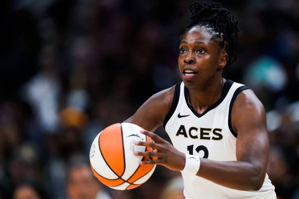 Las Vegas Aces guard Chelsea Gray (12) passes the ball during the first half of the team's WNBA ...