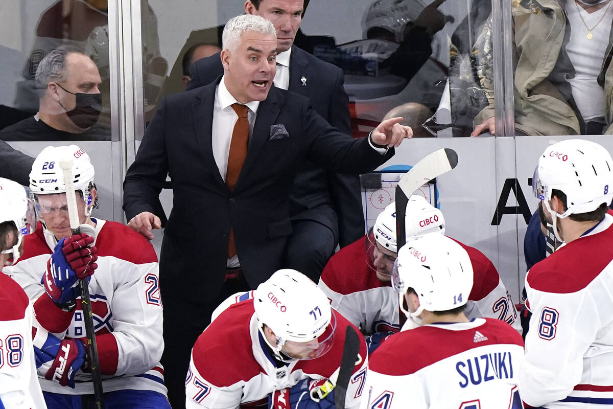 Montreal Canadiens head coach Dominique Ducharme talks to his team during overtime period of an ...