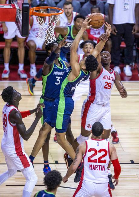 Minnesota Timberwolves forward Josh Minott (8) is fouled on a shot by Atlanta Hawks forward Mfi ...