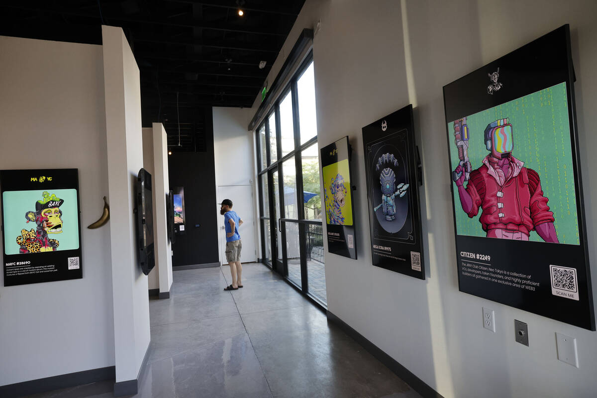 People look at NFT digital arts at JRNY Gallery, Friday, July 7, 2023, in Las Vegas. (Chitose S ...
