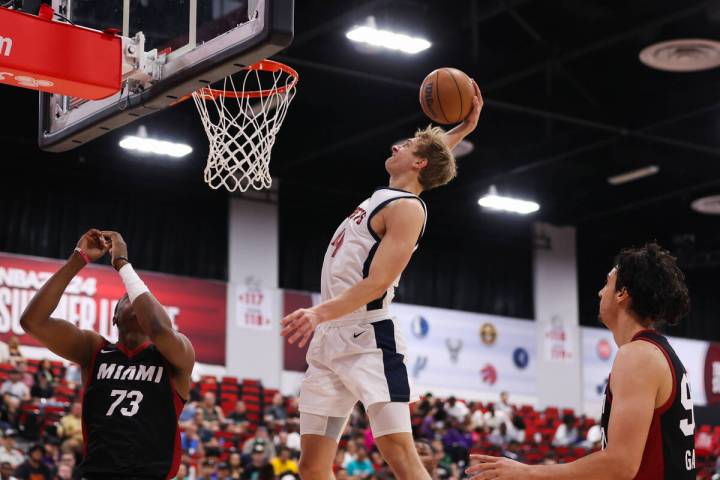 Denver Nuggets forward Hunter Tyson (4) dunks the ball during an NBA Summer League game at the ...