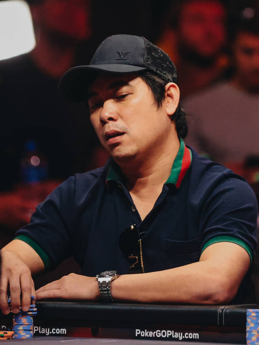 Cong Pham holds onto his stack of poker chips during the World Series of Poker $10,000 buy-in N ...