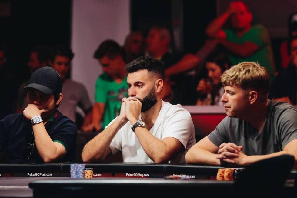 Dean Hutchison, center, watches a competitor during the World Series of Poker $10,000 buy-in No ...