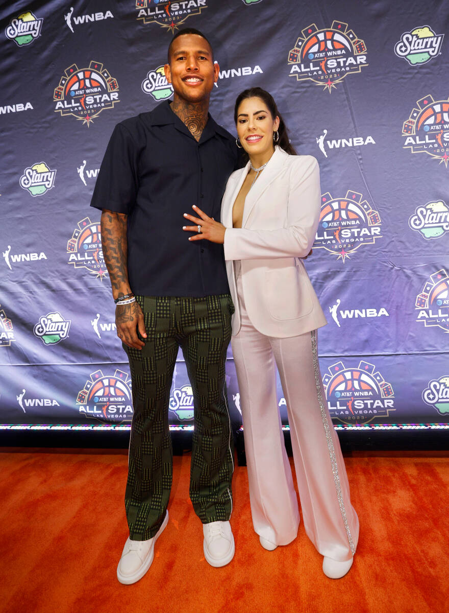 Kelsey Plum of Las Vegas Aces poses for a photo with New York Giants’ Darren Waller on t ...