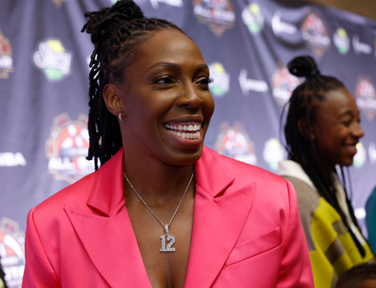 Chelsea Gray of Las Vegas Aces poses for a photo on the WNBA Orange Carpet outside Della's Kitc ...