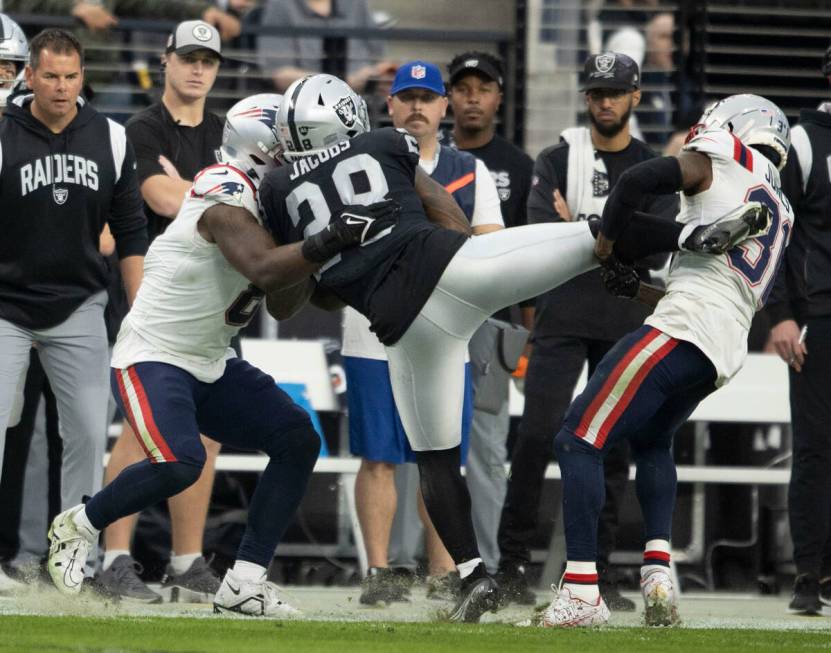 New England Patriots cornerback Jonathan Jones (31) and linebacker Ja'Whaun Bentley (8) work to ...