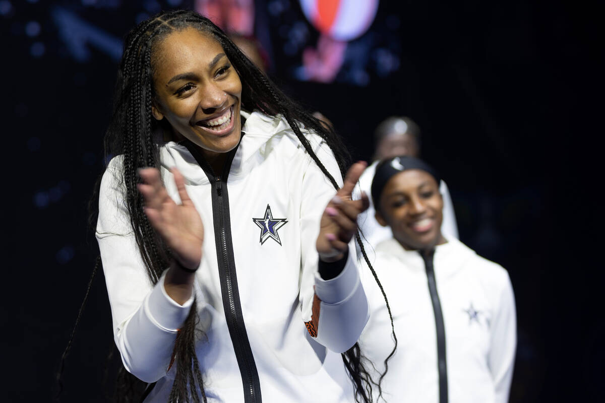 Las Vegas Aces' A'ja Wilson, captain of Team Wilson, claps as her team is introduced before the ...