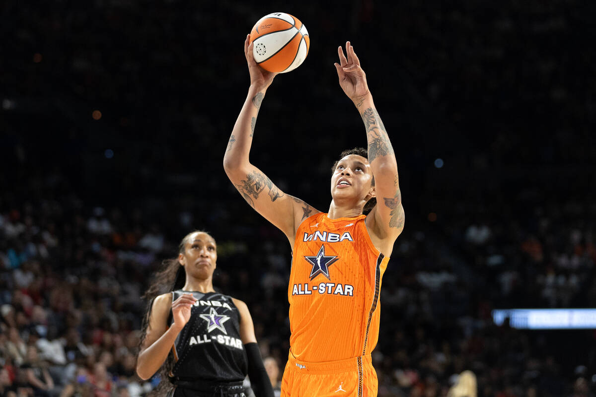 Phoenix Mercury's Brittney Griner, of Team Stewart, shoots while Las Vegas Aces' A'ja Wilson, o ...