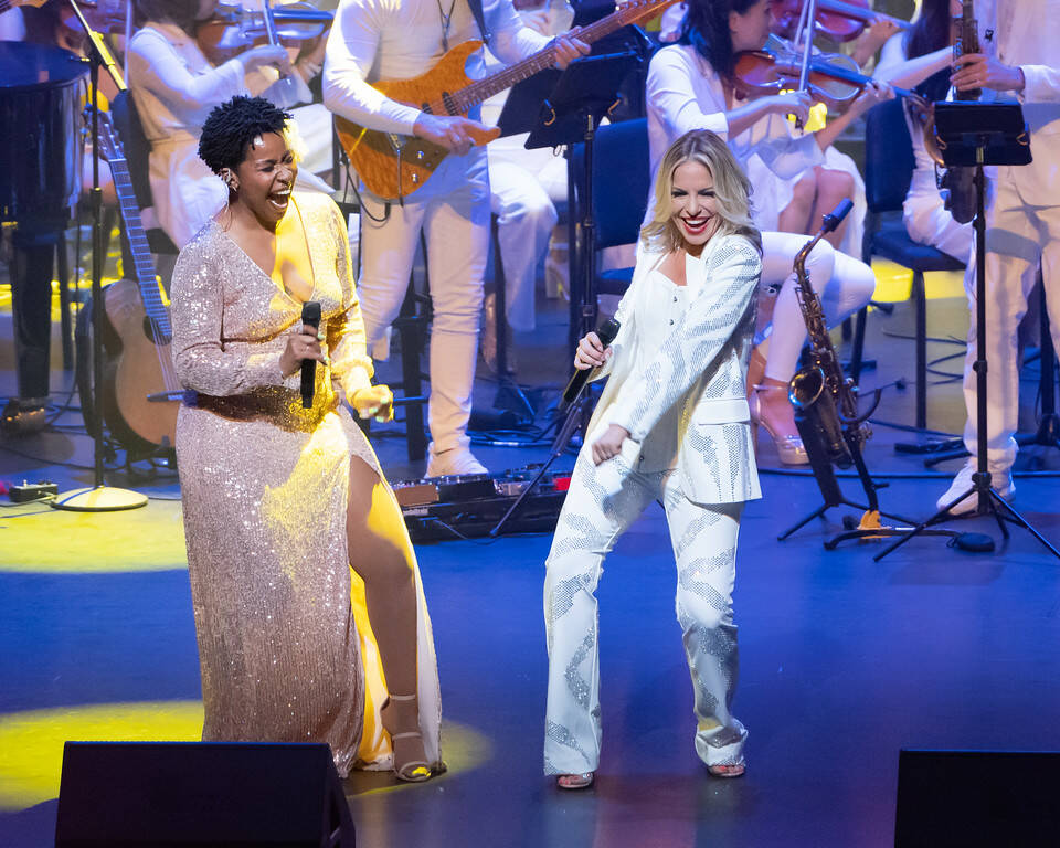 Serena Henry and Lily Arce of David Perrico's Pop Symphonic orchestra are shown at Reynolds Hal ...